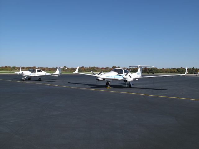 Diamond Twin Star (N510TS) - A Diamond Twin Star DA-42 (N510TS) parked next to its little brother, a Diamond Star DA-40 (N16NA), on the Louisville Executive Aviation ramp at Bowman Field, Louisville, Kentucky.