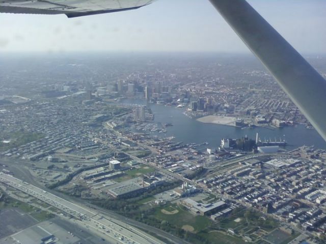 Cessna Commuter (N18167) - Departing KBWI via Runway 33R to the east over Baltimore.