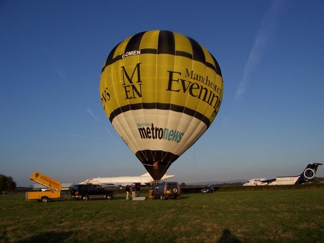 — — - The slowest and the fastest passenger air transport of all time A hot air balloon and Concord at Manchester Airport UK