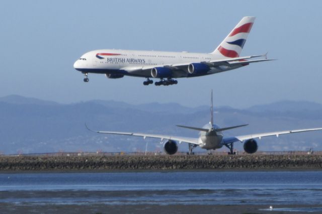 Airbus A380-800 — - British Airways A380 Landing on runway 28R, with Qatar A350 waiting for takeoff clearance on 28L.