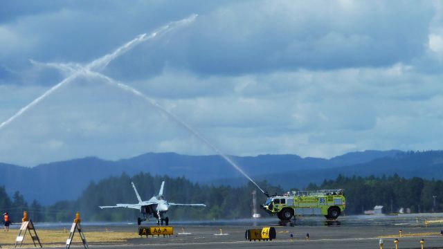 McDonnell Douglas FA-18 Hornet — - Getting the water cannon salute after his final air show demonstration.