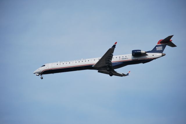 Canadair Regional Jet CRJ-900 (N925FJ) - Approaching runway 23 - 3/11/09