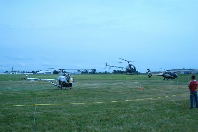 N2032S — - Schweizer 300 CB and other helicopters - They were giving rides during the airshow, July 13, 2023.