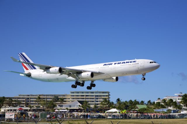 Airbus A340-300 (F-GLZU) - Air France Flight 3510 touches down in Sint Maarten on New Year's Eve..  Their New Year will be celebrated in the air on the return flight..!