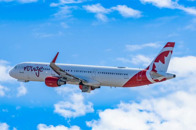 Airbus A321 (C-FJQL) - An Air Canada Rouge A321 taking off from PHX on 2/11/23 during the Super Bowl rush. Taken with a Canon R7 and Canon EF 100-400 II L lens.