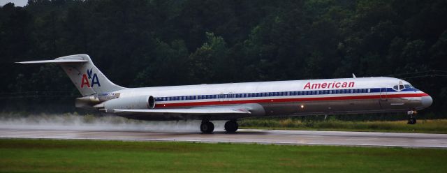 McDonnell Douglas MD-83 (N965TW) - American Mad Dog kicking up the rain - a plane near and dear to my heart.  N965TW was the first airplane I ever flew.  From the RDU observation deck, 5/28/18.