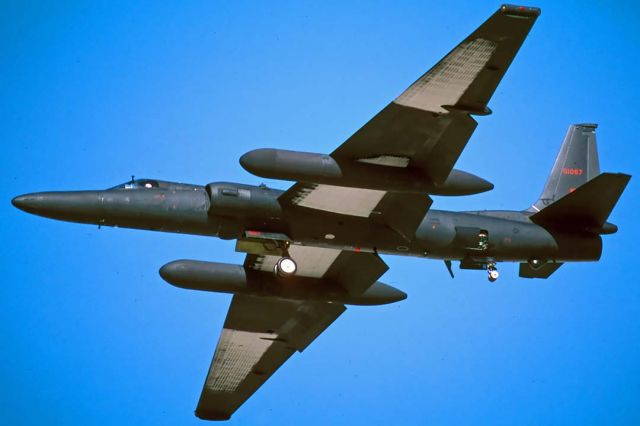 Lockheed ER-2 (80-1067) - Air Force Lockheed U-2S 80-1067 on approach to land at Air Force Plant 42 in Palmdale, California on November 22, 2000. It carries a little red skunk on its tail. Ice has formed on areas of the wing that are cooled by cold-soaked fuel remaining in the bottom of the tanks.