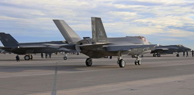 Lockheed F-35C (16-9425) - A VFA-101 "Grim Reapers" F-35C (169425)(Eglin AFB, FL), piloted by LCDR Patrick "Turtle" Rice, rolls out of the line as the second of four Lightning IIs taxi away from NAS Fallons north ramp to participate in an early morning (0730 hours) training exercise.  And yes, the aircraft in the background on the left is a VFA-125 "Rough Raiders" F-35C (NAS Lemoore) and way in the background on the right is a VX-9 "Vampires" F-35C (NAWS China Lake but detached to Edwards AFB, CA).  It was F-35C heaven yesterday; no matter which way I turned, I was photographing Lightning.br /br /This photo is the first snap of 169425 to be posted into the FA photo gallery.br /br /My deepest and most sincere Thanks go out to "Turtle," "Potty," and "Squatch" for inviting me to be out on the north ramp surrounded by the eight "Grim Reapers," "Rough Raiders," and "Vampires" F-35s.  