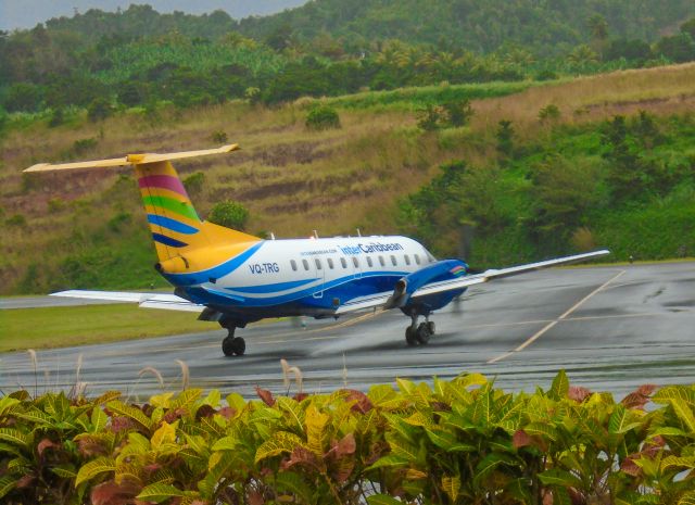 Embraer EMB-120 Brasilia (VQ-TRG) - VQ-TRG moving out via Taxiway Bravo on a rainy morning to Barbados as JY707.