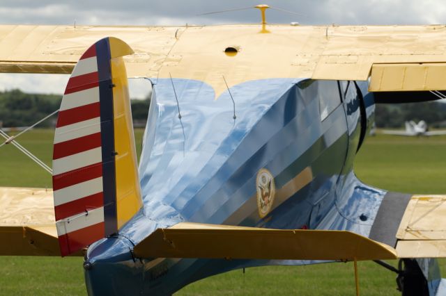 — — - The light helps accentuate the interesting hull structure of this Staggerwing on static display at Duxford Air Museum.