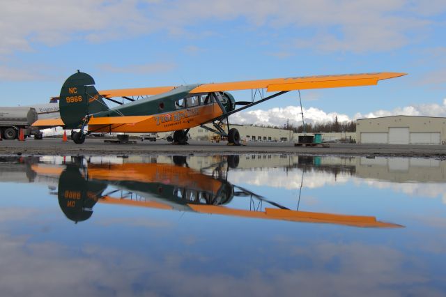 NAC9966 — - The reflection here of this 1929 Travel Air was provided by the last standing melt water of this previous winters melt. This plane has been meticulously restored. It is a real beauty of an airplane that is beyond museum quality, yet still flies like a champ to get to the shows!!!