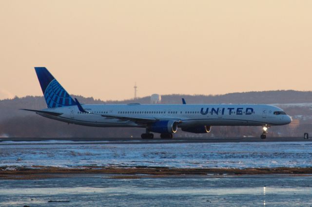 BOEING 757-300 (N75854) - United B757-300 in the new livery departs BOS at sunset on 2/15/22.