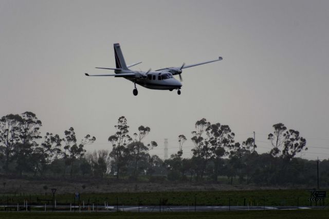 Aero Commander 500 (VH-YJL) - Never seen a plane land on this angle before!