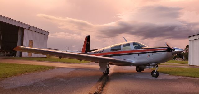 Mooney M-20 Turbo (N403LA) - Mooney 231, N403LA, at Kissimmee, FL. Picture taken after landing in an evening rain shower. No filters or modifications used. 