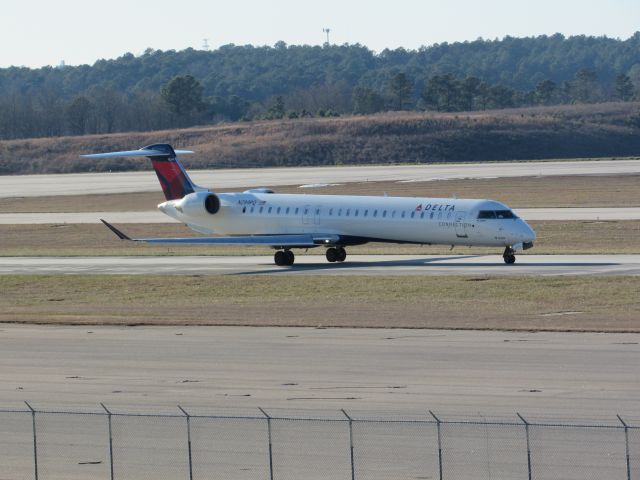 Canadair Regional Jet CRJ-900 (N299PQ) - Delta Connection (Endeavor Air) flight 3719 to La Guardia, a Bombardier CRJ900 taxiing to takeoff on runway 23R. This was taken January 30, 2016 at 4:08 PM.