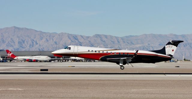 Embraer ERJ-135 (N900EM) - Touching down on 26L preparing to mow down the Virgin Atlantic 744.