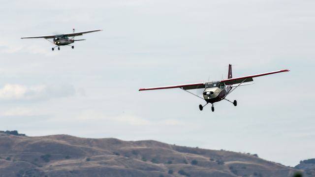 Cessna Skyhawk (N2774J) - Heavy lunchtime  traffic at Van Nuys Airport.  This is a Los Angeles, California business/recreational airport with two parallel runways. The C206 to the left is landing on the right runway. 