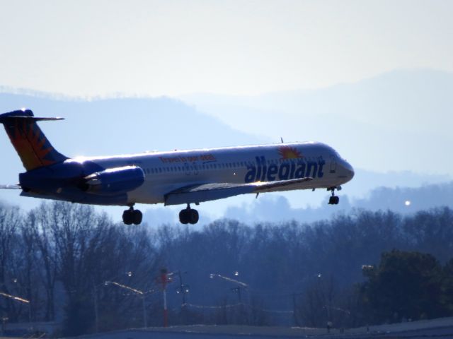 Airbus A320 (N874GA) - Landing with the hazy Great Smoky Mountains in the background.