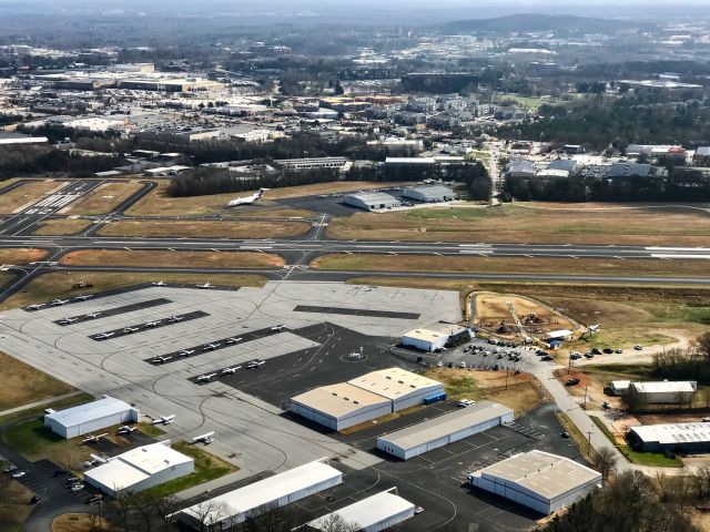 — — - Overview of Downtown Greenville Airport.  You can see the runway cafe, runway park and FedEx 727.