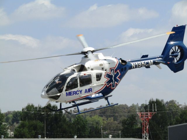 Eurocopter EC-635 (N135CM) - Mercy Air EC-635 lifting off from Fullerton Airport 5.13.2017