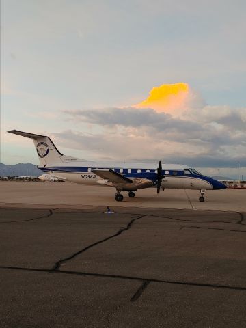 Embraer EMB-120 Brasilia (N126CZ) - Freight Runners Express E120 sitting on the cargo ramp awaiting its load for Gary, Indiana with a monsoon storm brewing in the background.