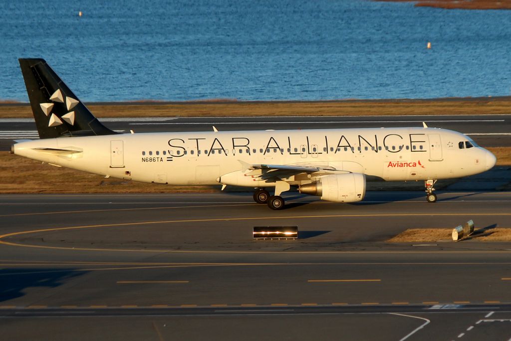 Airbus A320 (N686TA) - 'TACA 445' pulling onto 'November'