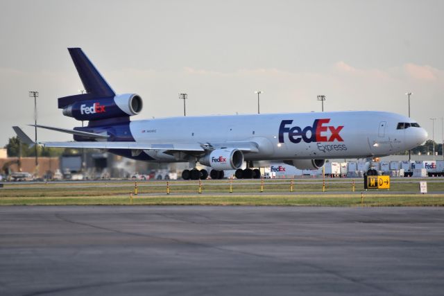 Boeing MD-11 (N624FE) - Rare Runway 32 departure for a FedEx MD-11, headed to LAX 07-06-22. Note the taxiway signage under the nose gear. Taxi-ways M&D as in "MD-11"