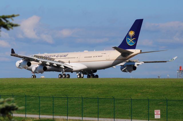 Airbus A340-200 (HZ-HMS2) - Wearing Saudi Arabian Airlines colors on the outside, outtted inside like a royal palace on the inside, this is not for revenue passengers. Rolling out on runway 6L after flying in from KIAD, probably to avoid Hurricane Irene.