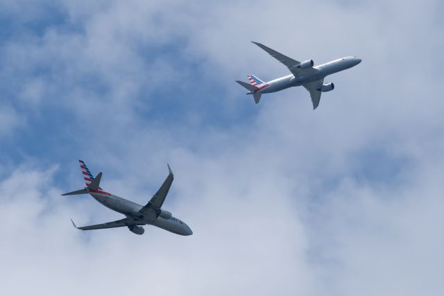 Boeing 737-800 (N803NN) - The 737 is turning final for the west side runways, the 787 is on a base leg for the east side runways