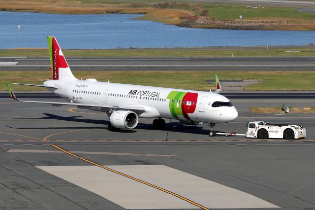 Airbus A321 (CS-TXG) - 'Air Portugal 218' getting towed to it's Terminal C departure gate