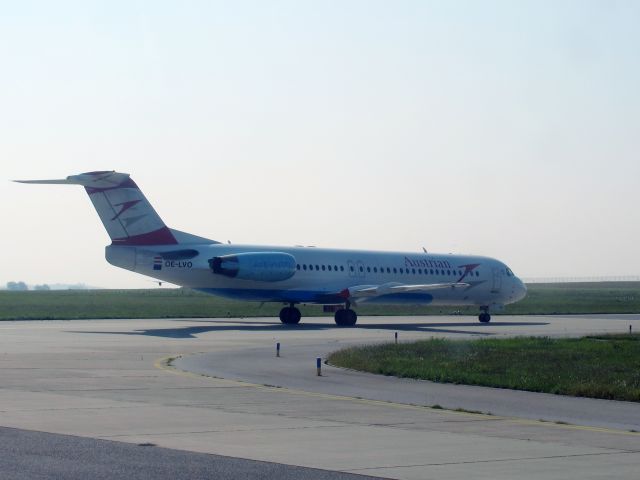 Fokker 100 (OE-LVO) - At Vienna, Austria. Holding short of runway 29.br /9 SEP 2014.