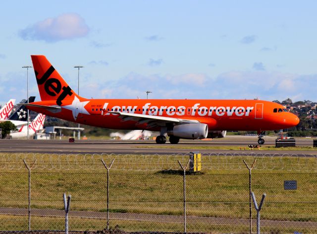 Airbus A320 (VH-VGF) - Photo taken at Sydney Airport in the unofficial spotters area