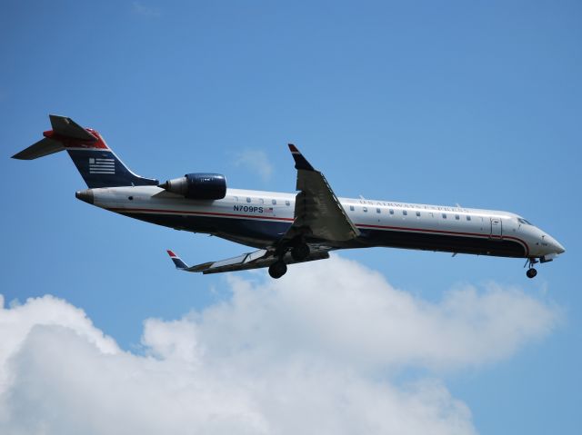 Canadair Regional Jet CRJ-700 (N709PS) - Final for runway 23 - 3/25/13