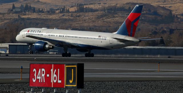 Boeing 757-200 (N679DA) - Delta's N679DA is captured as it is rotating from runway 16R at the start of a morning eastbound flight from Reno Tahoe International to Hartsfield-Jackson International (KRNO - KATL).