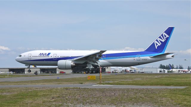 Boeing 777-200 (JA742A) - BOE592 (LN:1016) touches down on runway 34L to complete a flight test on 5/19/12.