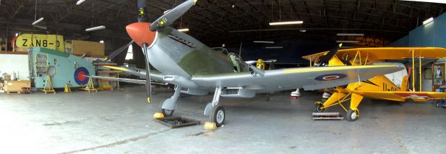 — — - Spitfire in Hanger