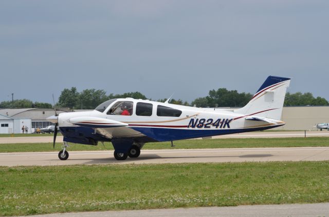 Beechcraft Bonanza (33) (N8241K) - Bonanza mass arrival at AirVenture 2014