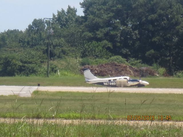 Beechcraft Baron (58) (N678MG) - Taken: Public Viewing area @ KORFbr /Camera: Canon PowerShot ELPH 110 HS