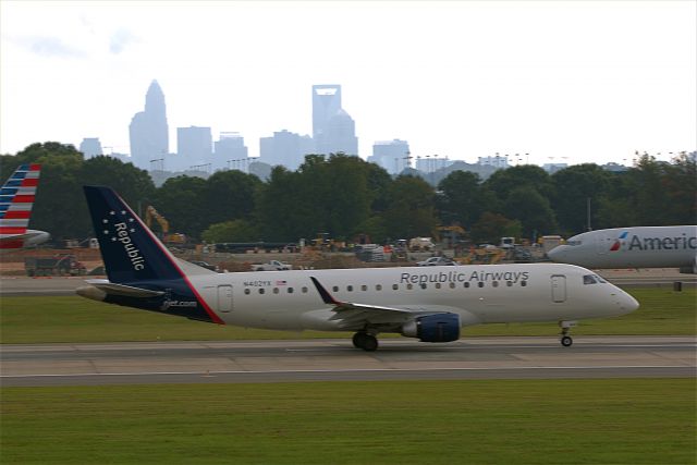 N402YX — - 402YX taking off at CLT with the city in the background