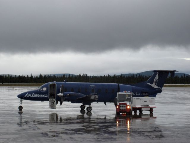 Beechcraft 1900 (C-GLHO) - C-GLHO, Air Labradors Beech 1900 on the ground in Goose-Bay, Newfoundland & Labrador, sitting in the rain with the GPU - August 2007