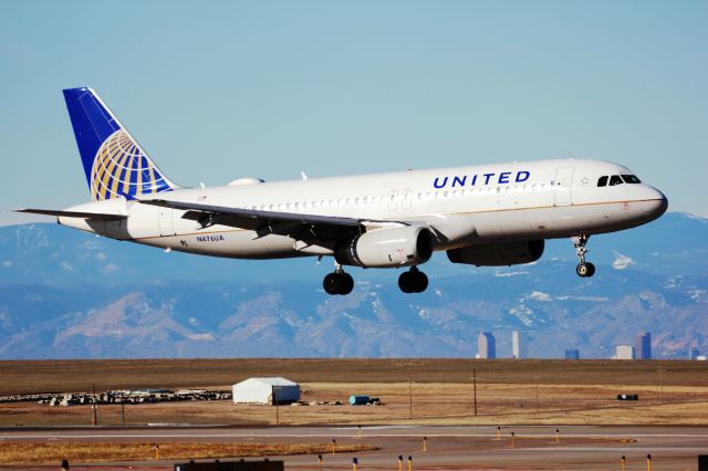 Airbus A320 (N476UA) - Landing on 34R. Downtown Denver can be seen in the lower right.