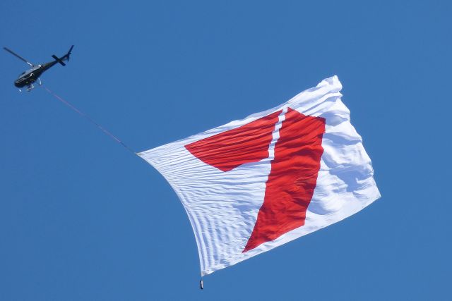 Eurocopter AS-350 AStar (VH-JTQ) - Carrying a Seven Network flag at the Australia Day Airshow in Perth.