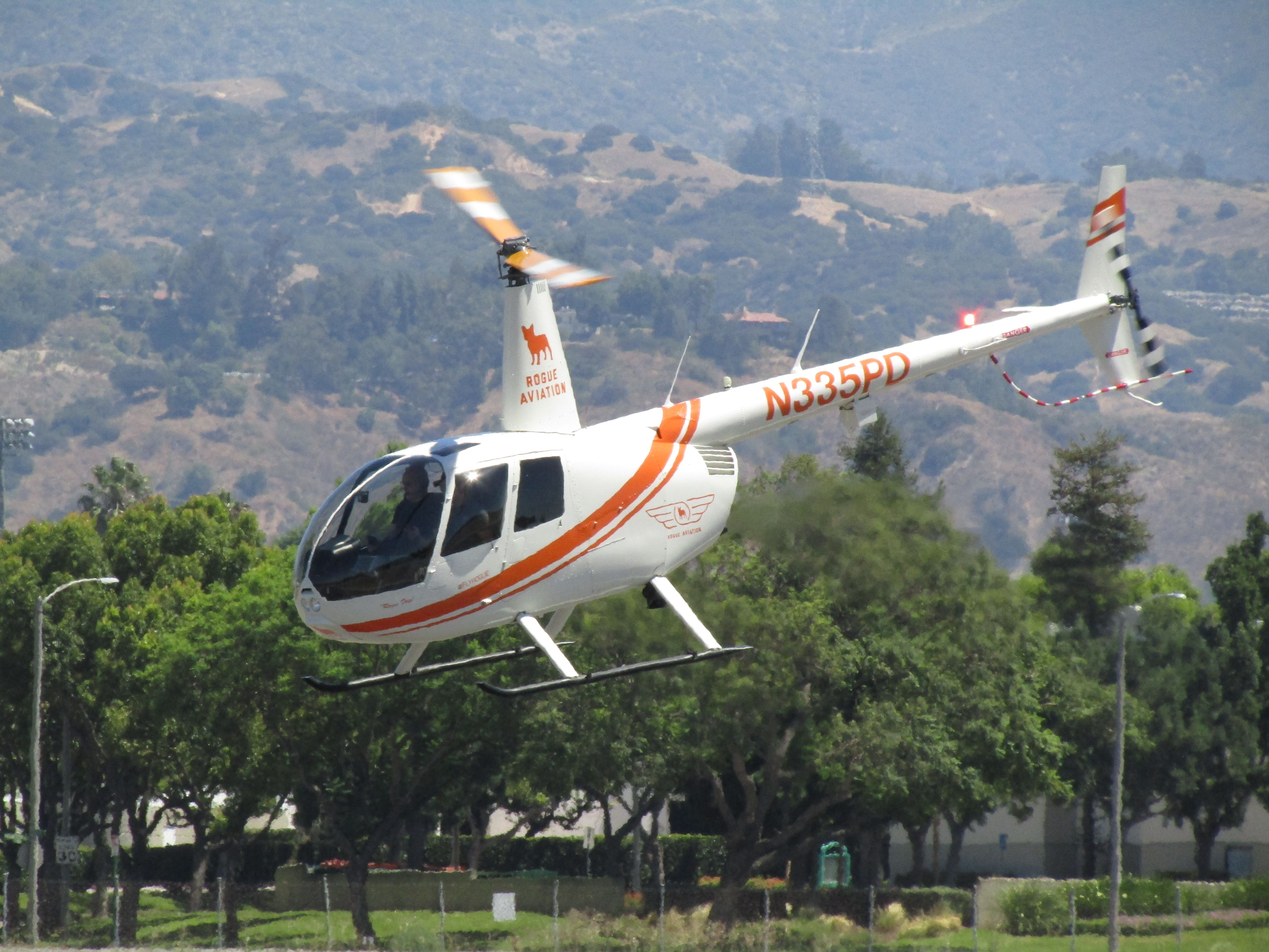 Robinson R-44 (N335PD) - Lifting off from RWY 26L