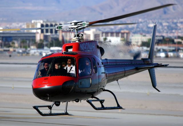 Eurocopter AS-350 AStar (N92MH) - KLAS - Apr 2nd, 2005 Maverick Helicopter "Jenny" returning to base after a flying trip over the Las Vegas Strip. These choppers very very busy this day with tourist crammed into the small helicopters and were in/out very quickly. click full.