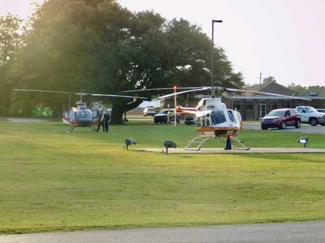 Bell 407 (N611PA) - Pafford Air One Echo getting ready for takeoff in Bolivar Medical Center with Air Evac 87 in the grass waiting for them to move