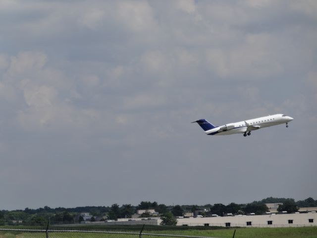 Canadair Regional Jet CRJ-200 (N895CL) - Standing just south of runway 02C, I was able to capture several aircraft on take-off