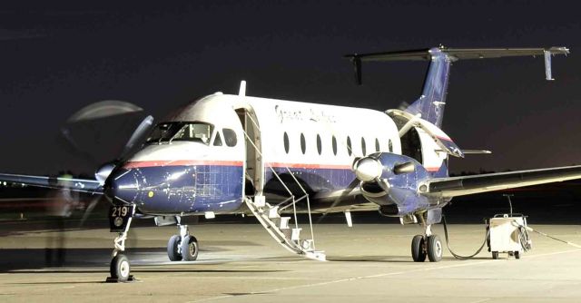 Beechcraft 1900 (N209GL) - Crew performing pre-flight inspection.