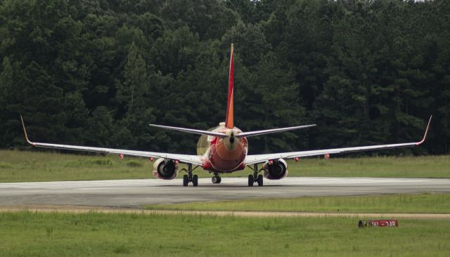 Boeing 737-700 (N714CB) - Southwest's Retrojet turning to complete it's short back-taxi on RW 34R for departure to HOU.