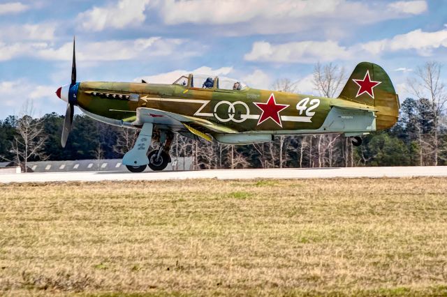 Experimental 100kts-200kts (N1157H) - A Yak-9U touches down at the Auburn, Alabama airport.