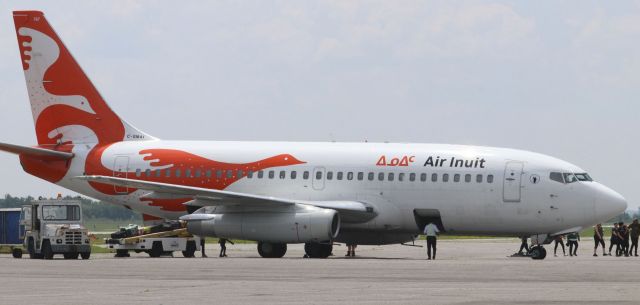 C-GMAI — - Starboard view of a 45-year old Boeing 737-200 (C-GMAI) in the striking livery of Air Inuit at YOW on 4 Jul 23.  Aircraft was chartered from YKL.   br /br /Air Inuit was founded by the Inuit of Nunavik (Northern Québec) in 1978 with a single de Haviland Beaver.br /br /This aircraft was first delivered to Air Gabon in 1978 and served with African carriers until it was acquired by Air Inuit in 2010 and modified for northern operations including flights from gravel runways.  Note the addition of the “gravel kit” a ski-like deflector mounted to the nose wheel, and vortex dissipators extending in front of each engine.br /br /On 3 Jul 23, Air Inuit announced the acquisition of three 737-800 combis to eventually replace the five -200s flying with the airline.